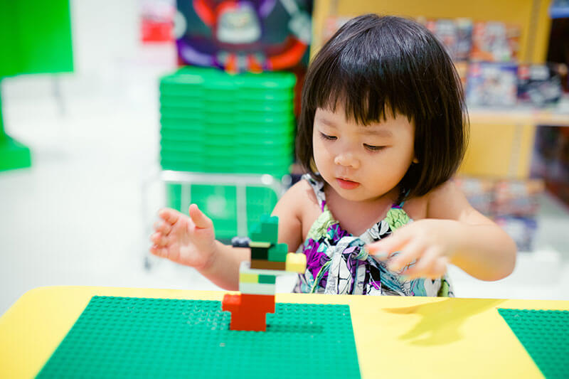 Girl Playing With Blocks